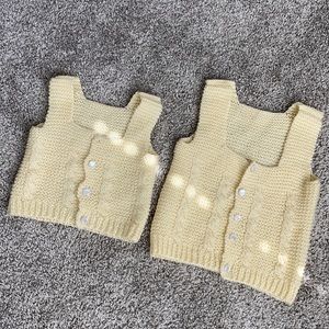 Bundle of hand knit warm button vests